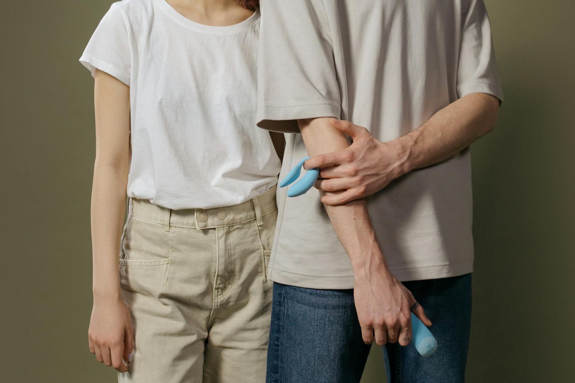 Hand holding a lemon against a vivid yellow background, symbolizing fresh reconnection and renewal